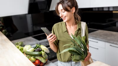 woman-with-fresh-groceries-on-the-kitchen-at-home.jpg